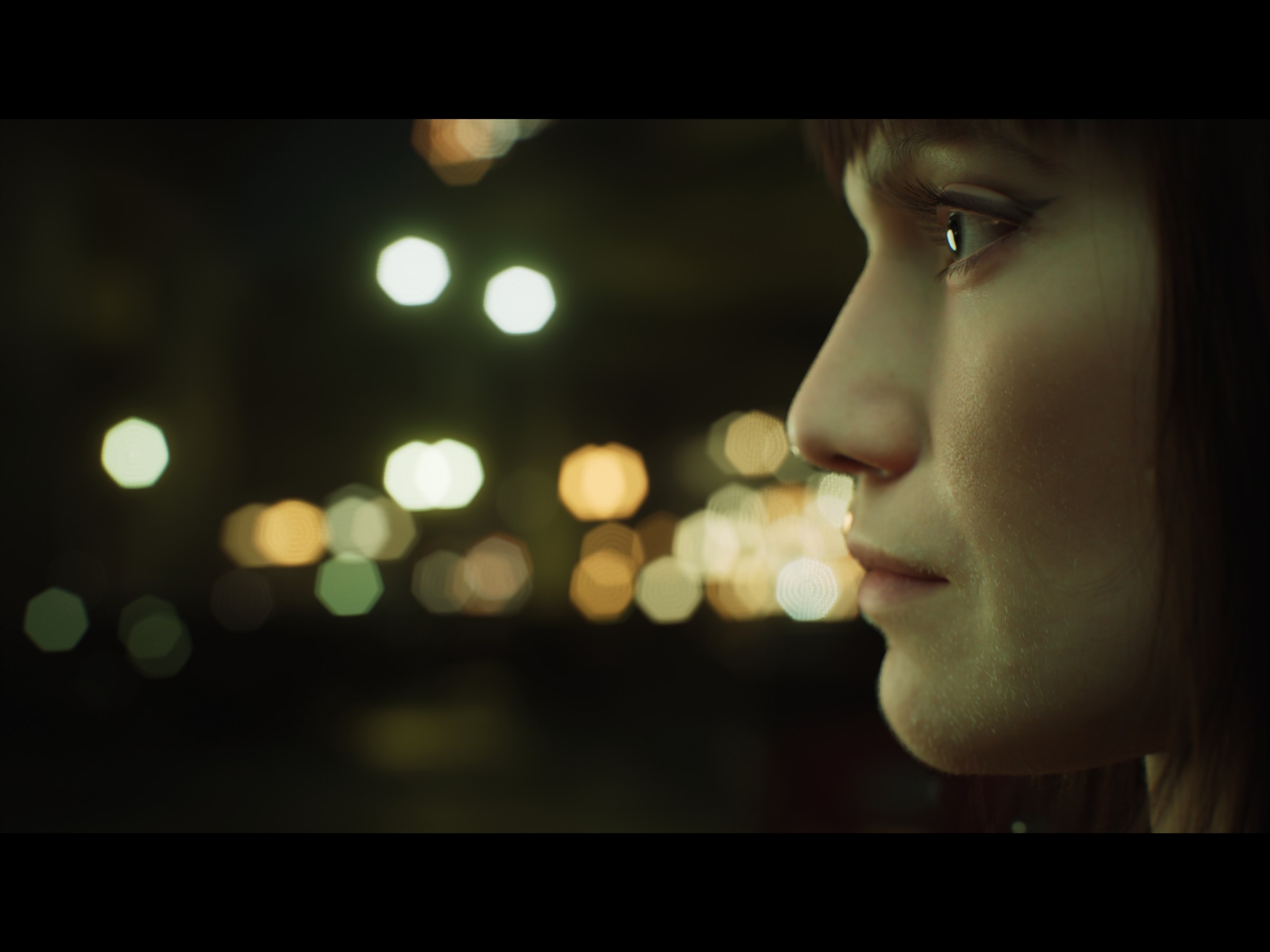 MetaHuman side profile surrounded by defocused city lights